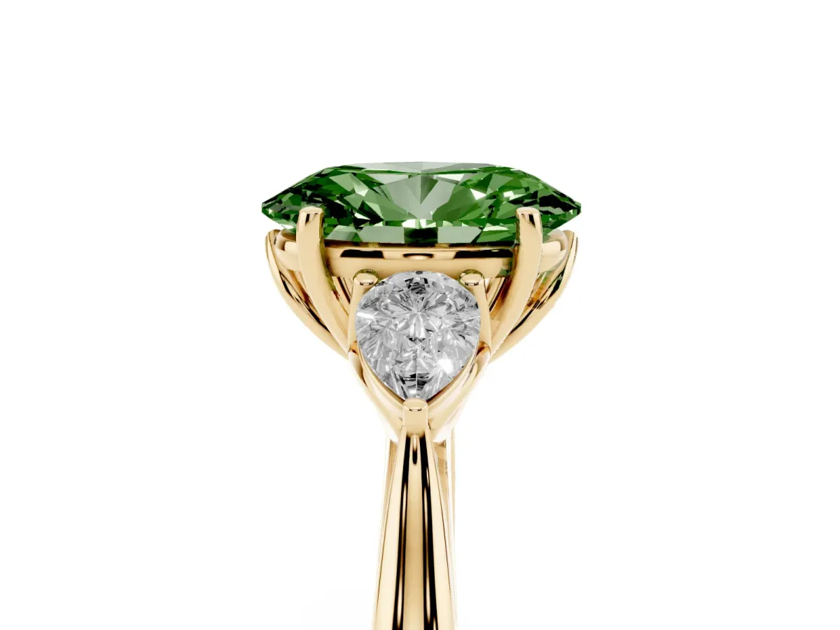 Fancy Green Three-Stone Oval Cut Diamond Ring with Pear Side Stones in Four-Prong Setting Yellow gold