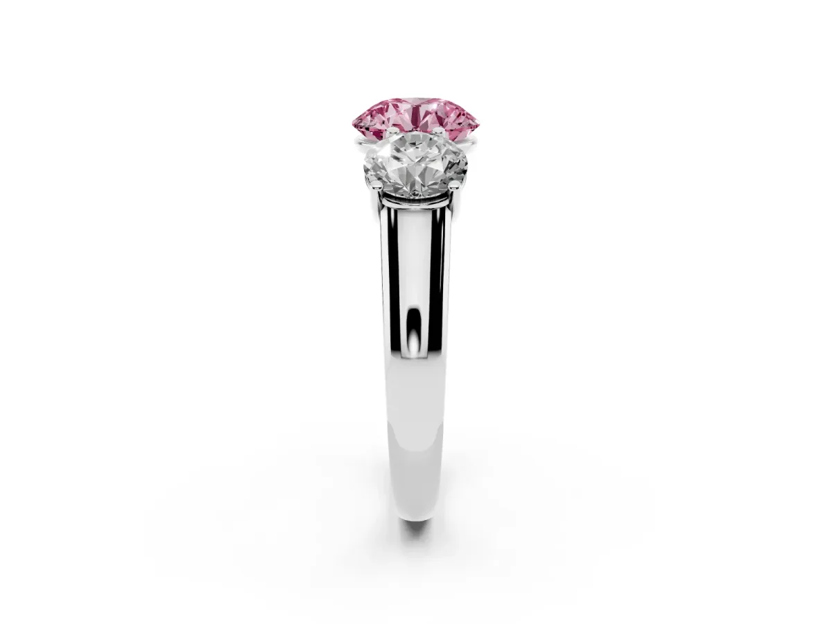 Fancy Pink Round Cut Three-Stone Diamond Ring with Prong Setting on a Classic Band Platinum