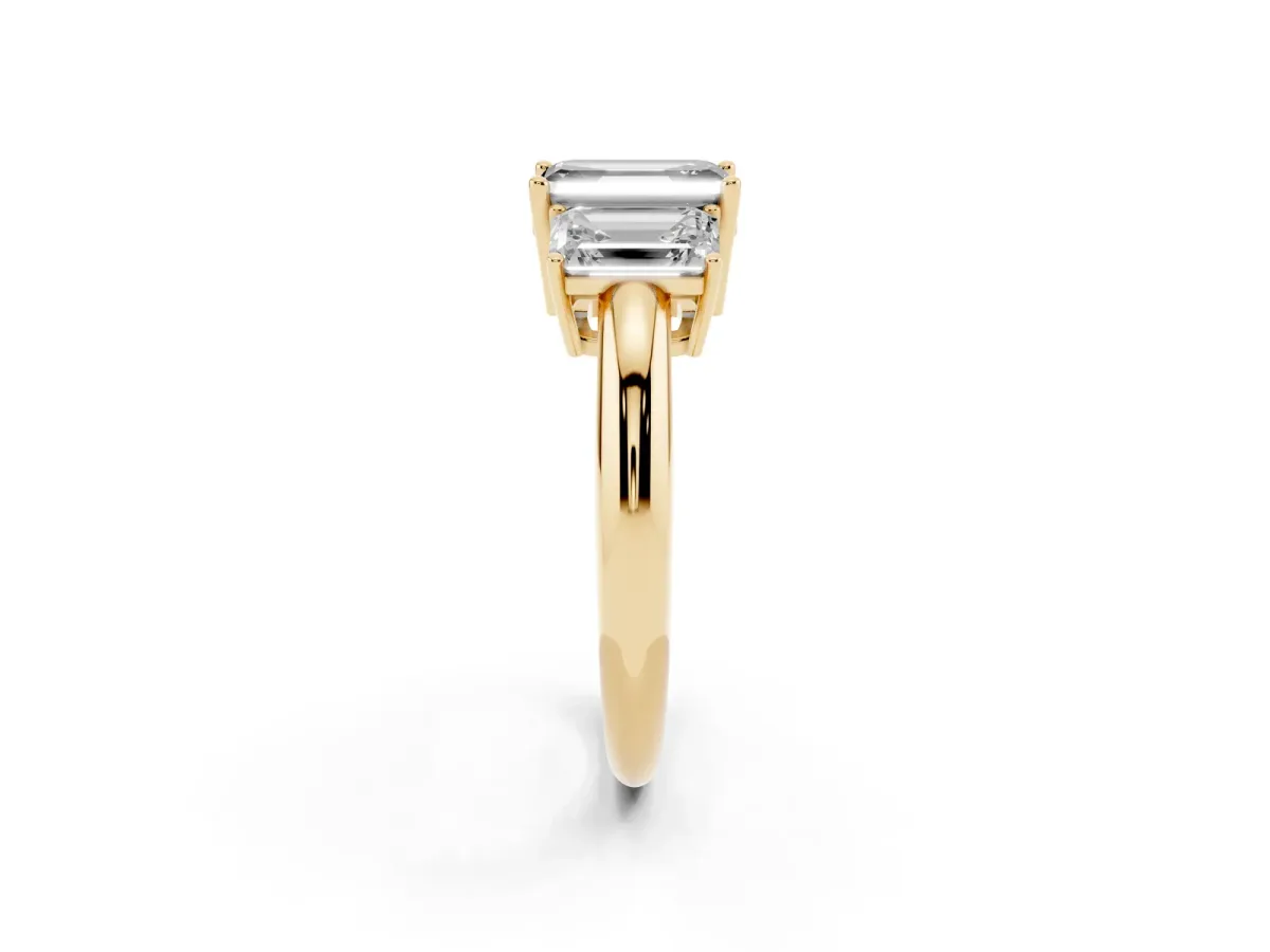 Fancy Black Three-Stone Emerald Cut Cut Diamond Engagement Ring with Prong Setting on a White Gold Band Yellow gold