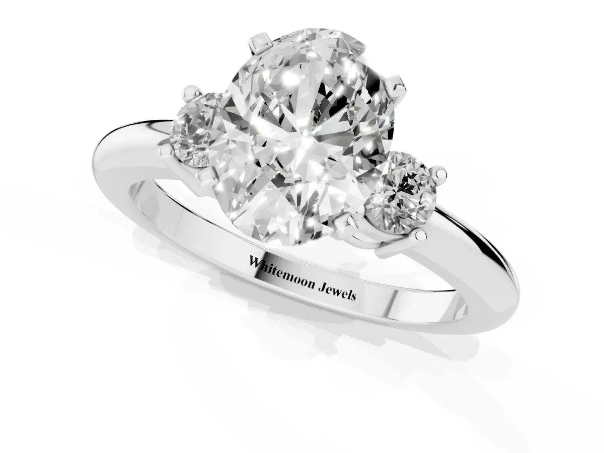 Three-Stone Oval Cut Cut Diamond Solitaire with Prong Setting and Classic Band Silver