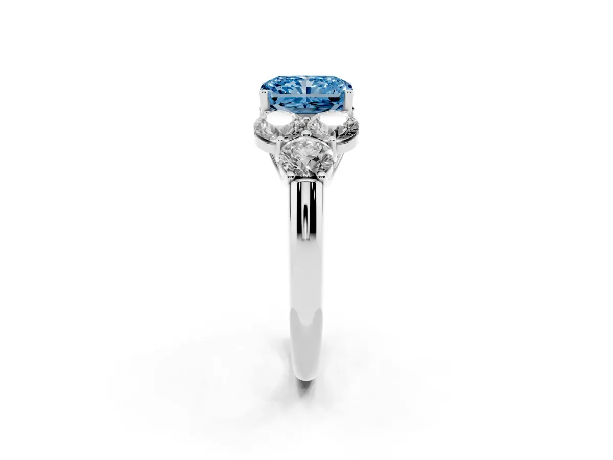 Fancy Blue Radiant Cut Cut Diamond Cluster Ring with Round Accent Stones and Prong Setting on a Classic Band White gold