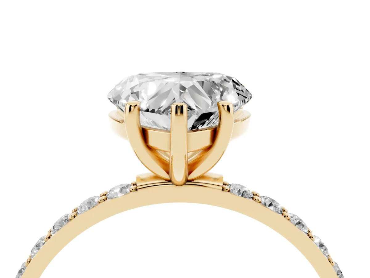 Heart Cut Diamond Solitaire Ring with Round Pavé Shoulders and Prong Setting Yellow gold