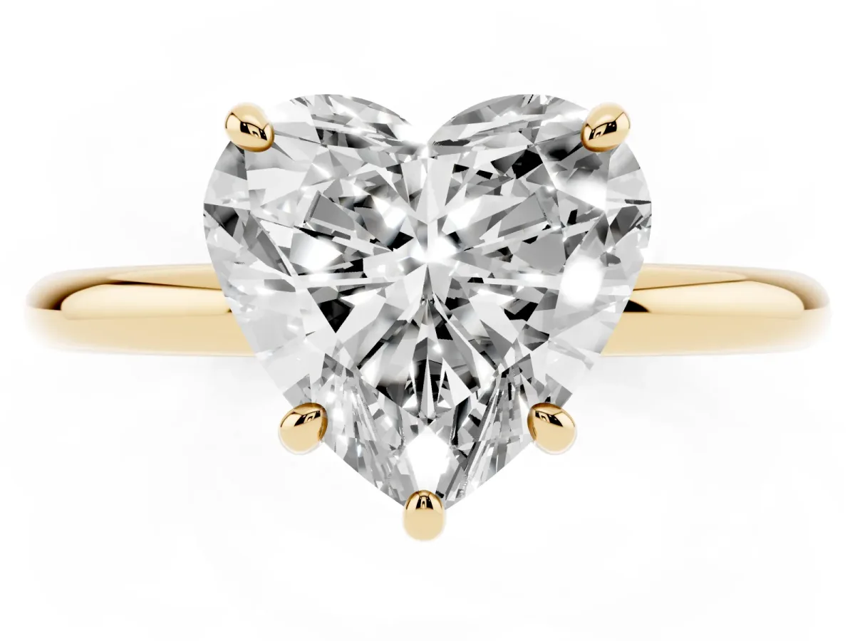 Heart Cut Solitaire Diamond Ring with Four-Prong Setting on a Plain Band Yellow gold