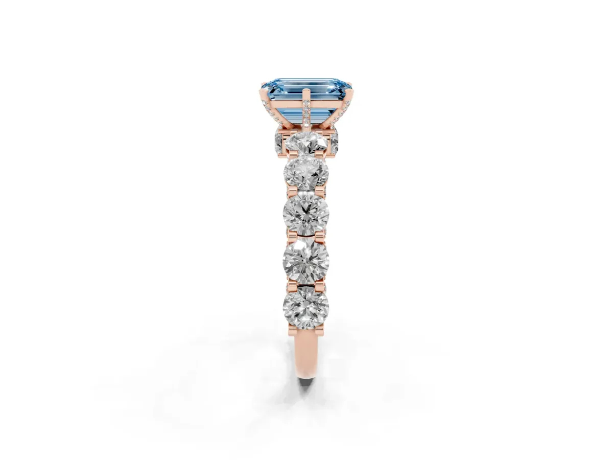 Fancy Blue Emerald Cut Diamond Side Stone Engagement Ring with Four-Prong Setting Rose gold