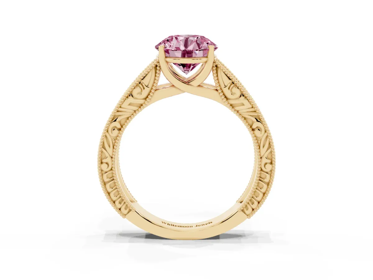 Fancy Pink Round Cut Diamond Solitaire Ring with Engraved Band and Four-Prong Setting Yellow gold