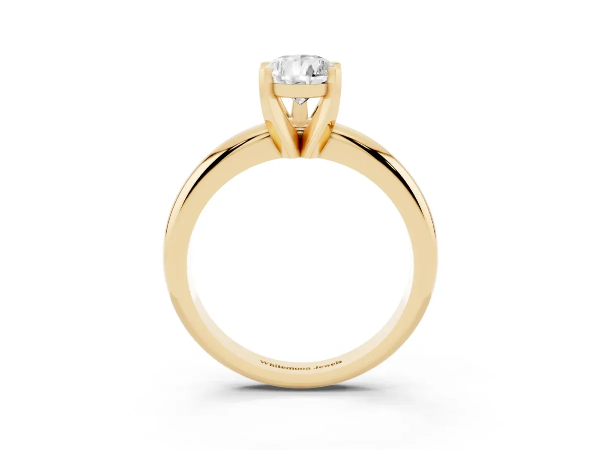 Pear Cut Diamond Solitaire Engagement Ring with Round Band and Four-Prong Setting Yellow gold
