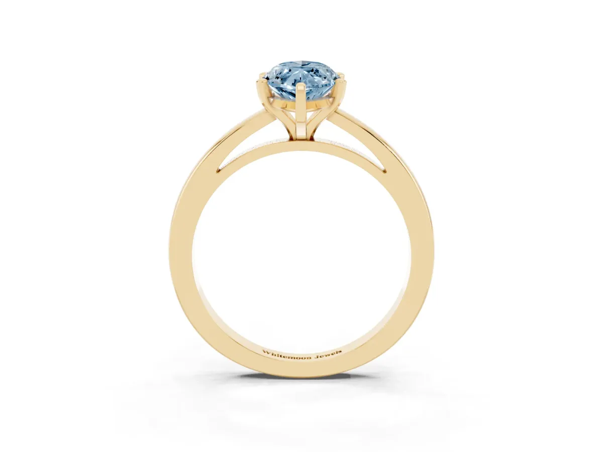 Fancy Blue Marquise Cut Solitaire Diamond Engagement Ring with Four-Prong Setting on a Classic Band Yellow gold