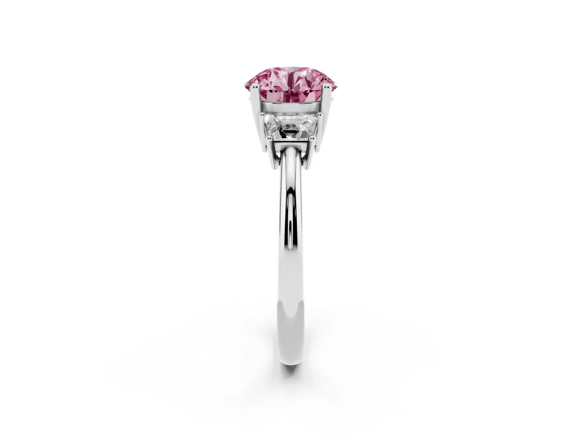 Fancy Pink Round Cut Diamond Three-Stone Ring with Trapezoid Side Stones and Prong Setting Platinum