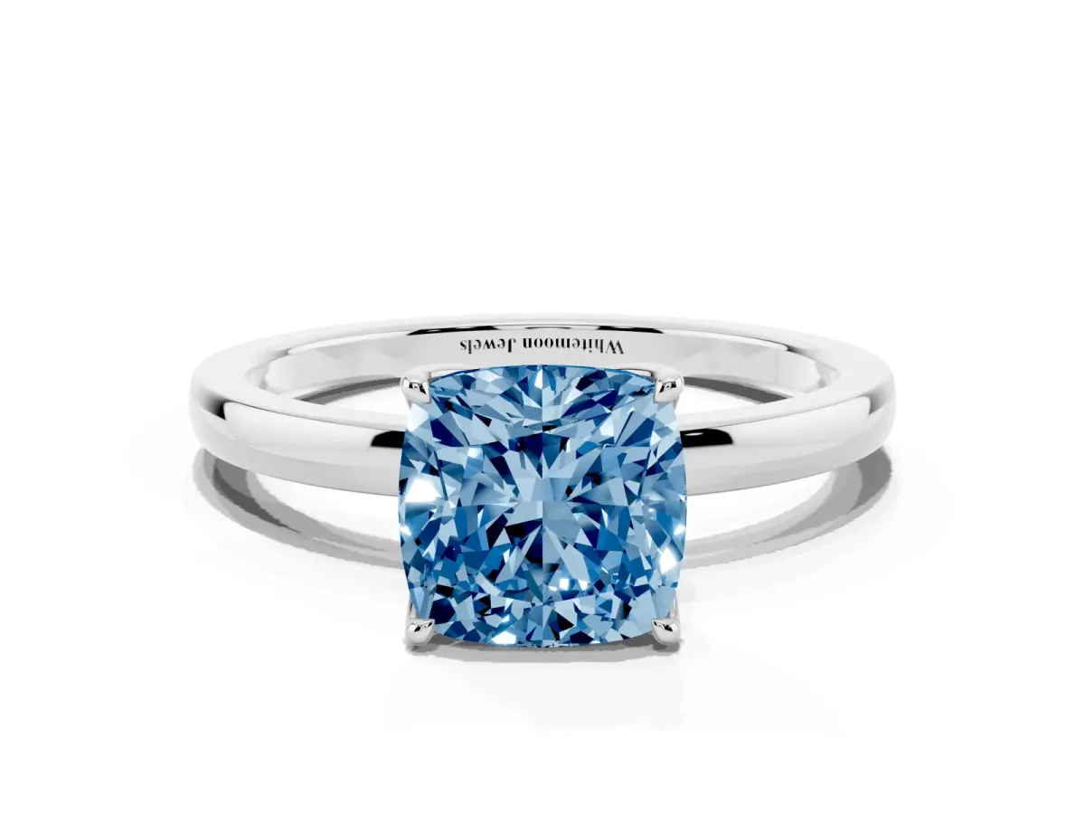 Fancy Blue Cushion Cut Diamond Solitaire Ring with Thin Band and Prong Setting Platinum