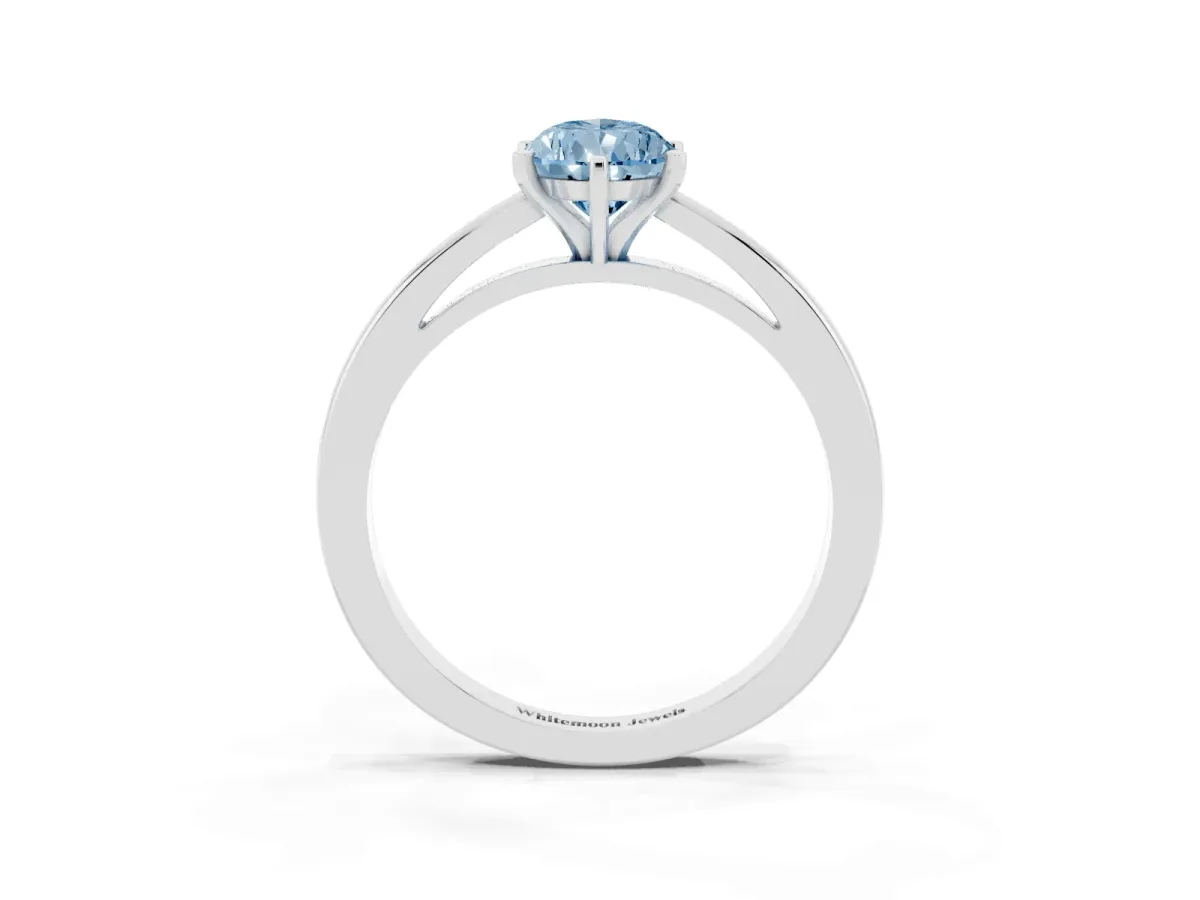 Fancy Blue Pear Cut Solitaire Diamond Engagement Ring with Four-Prong Setting on a Classic Band Silver