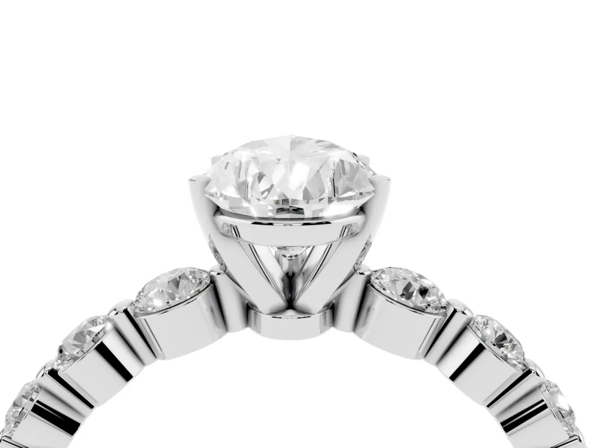 Pear Cut Solitaire Diamond Ring with Pave Band and Four-Prong Setting Silver