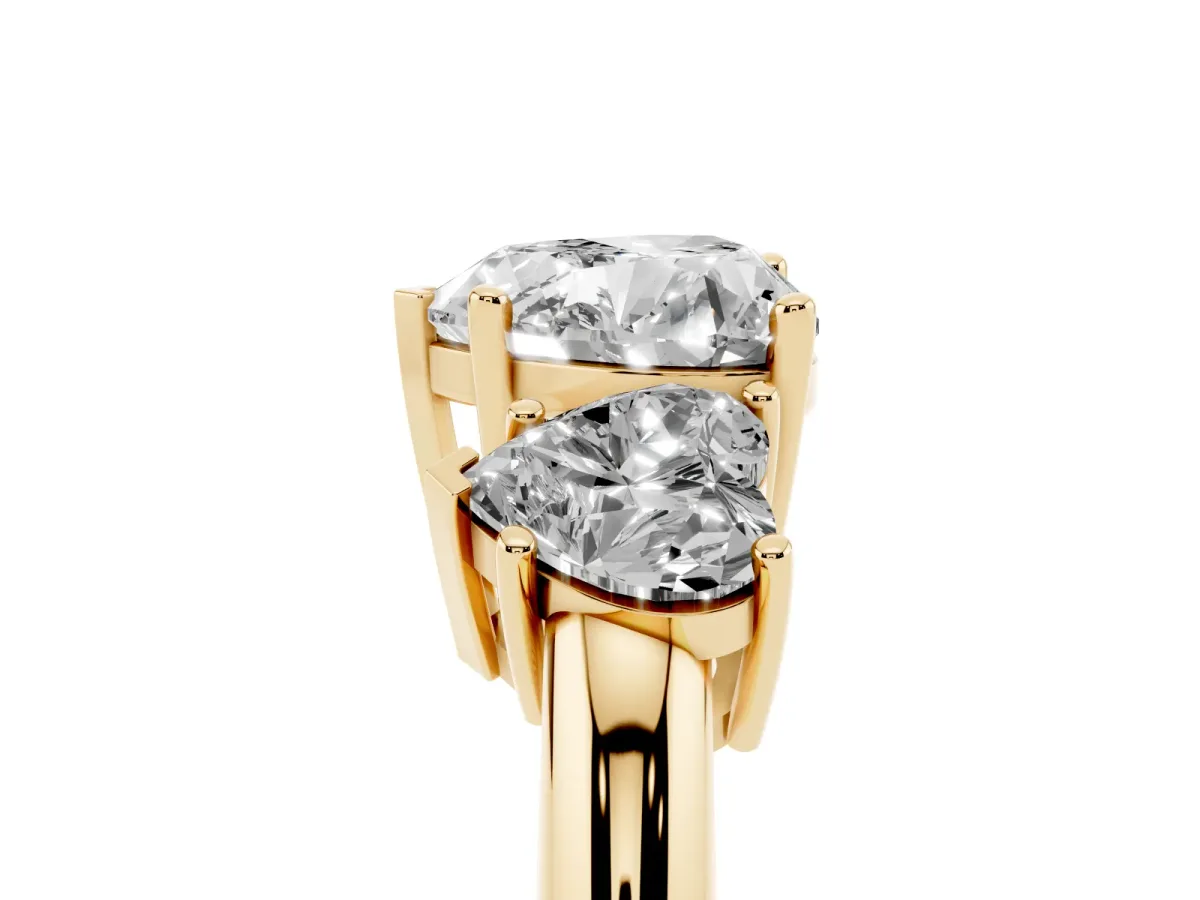 Three-Stone Heart Cut Cut Diamond Engagement Ring with Prong Setting on a White Gold Band Yellow gold