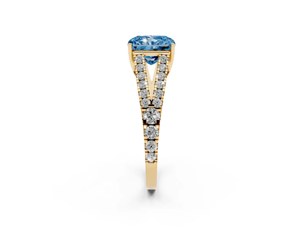 Fancy Blue Radiant Cut Diamond Split Shank Pavé Engagement Ring with Four-Prong Setting Yellow gold
