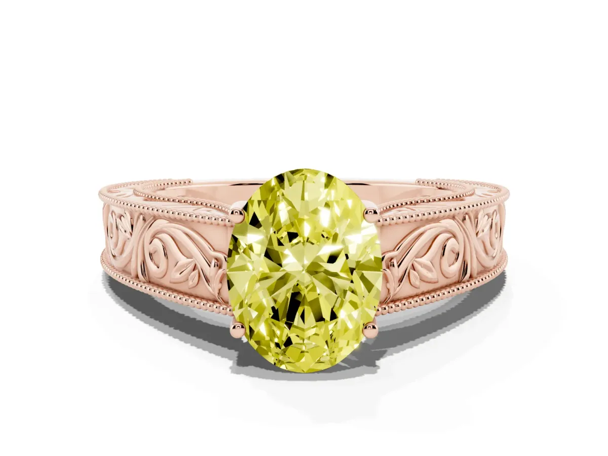 Fancy Yellow Oval Cut Diamond Solitaire Ring with Engraved Band and Four-Prong Setting Rose gold