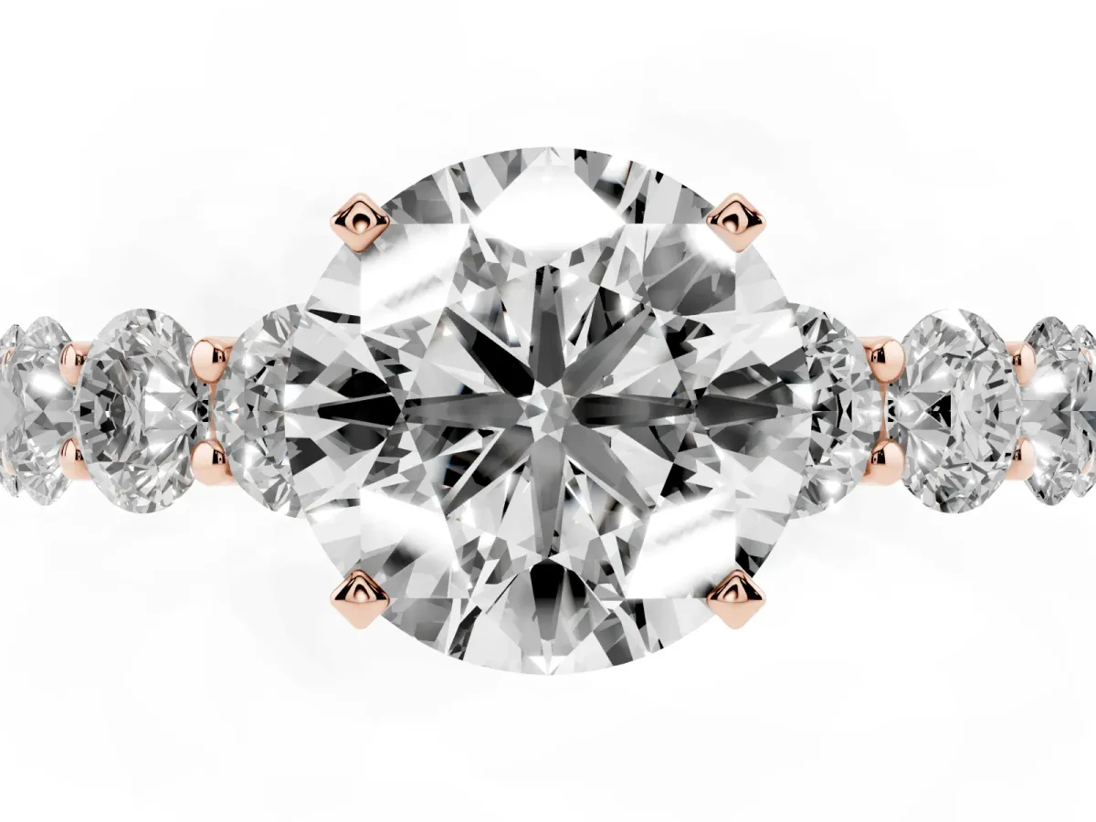 Round Cut Diamond Prong Setting with Side Stones on a Pave Band Rose gold