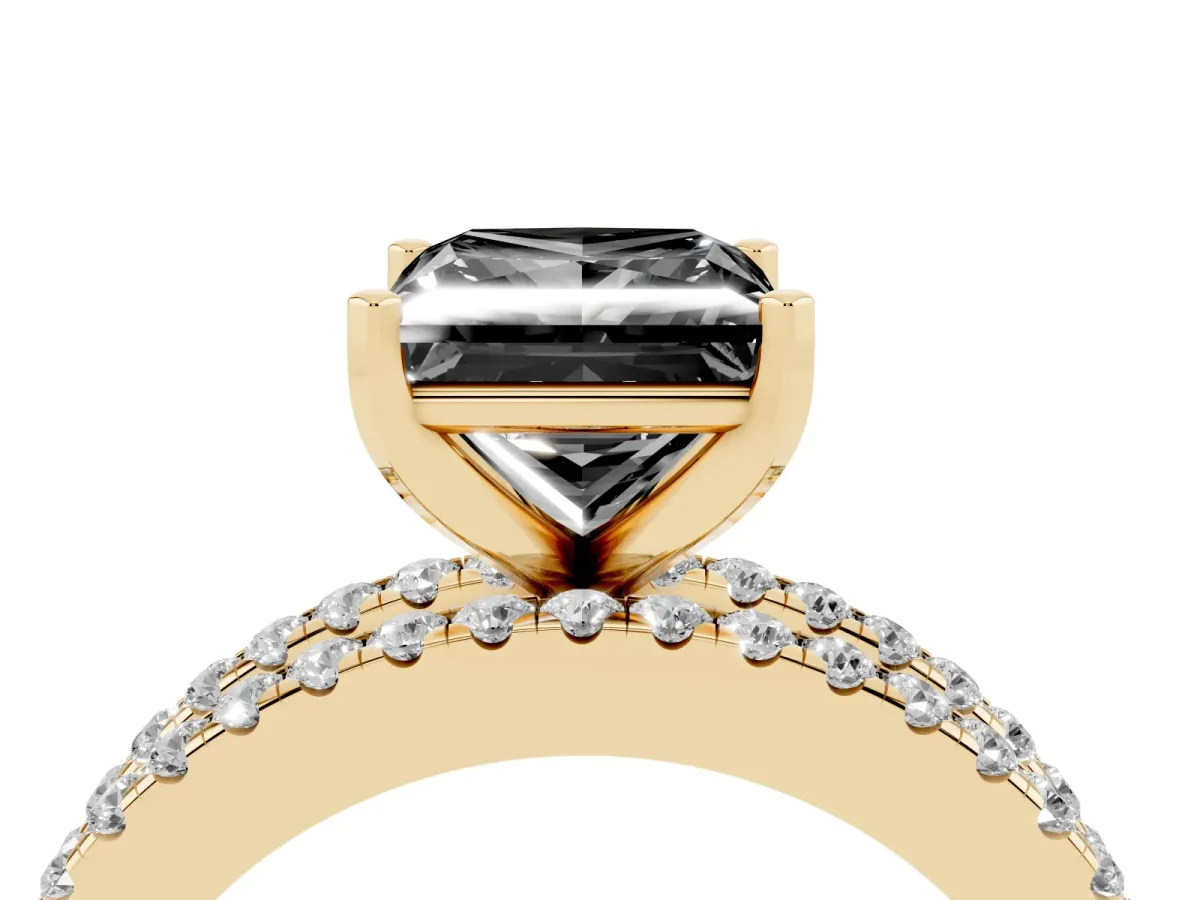 Fancy Black Princess Cut Diamond Solitaire Ring with Pavé and Channel Set Band Yellow gold