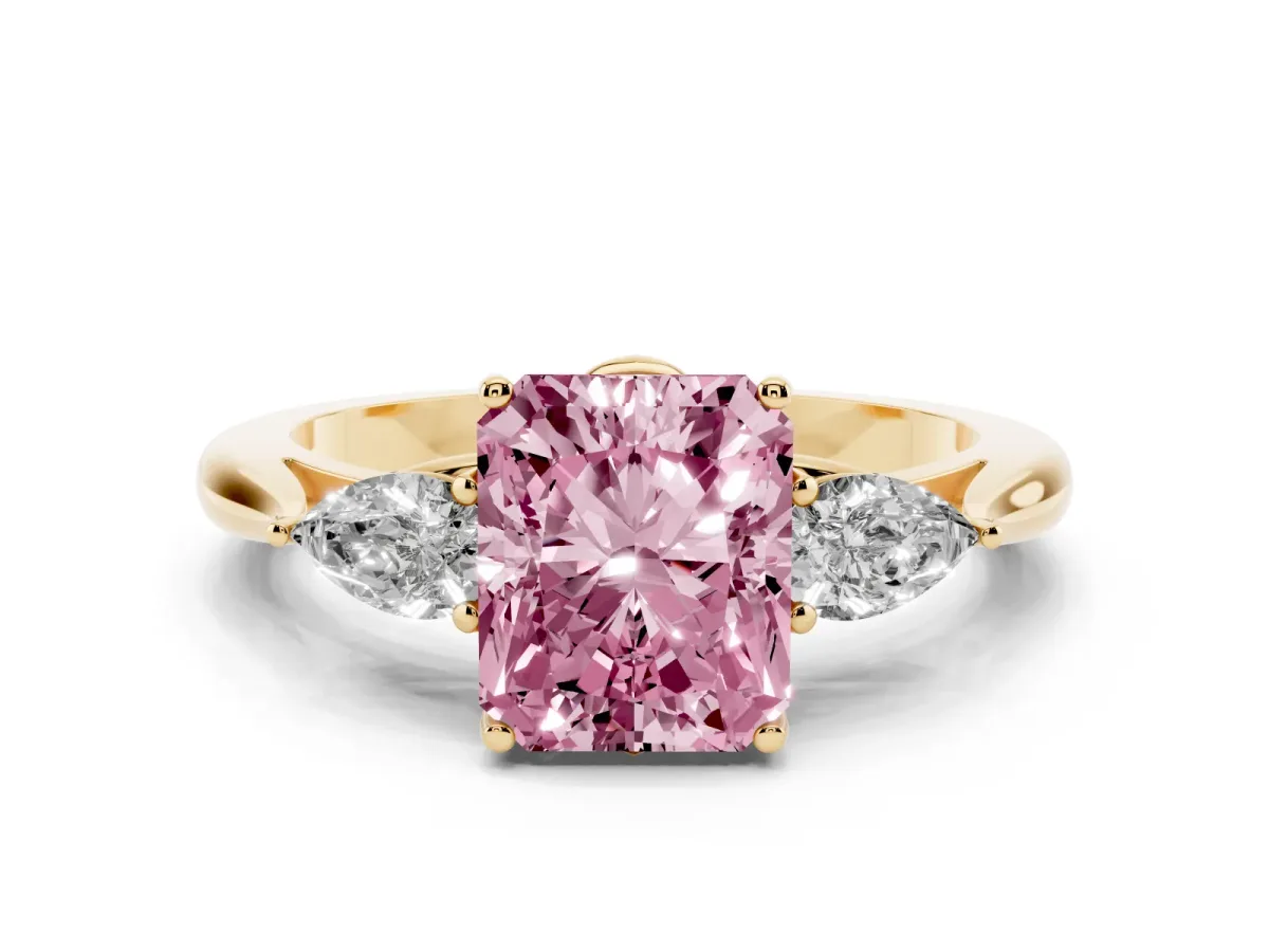 Fancy Pink Three-Stone Radiant Cut Brilliant Diamond Solitaire Ring with Tapered Band and Four-Prong Setting Yellow gold