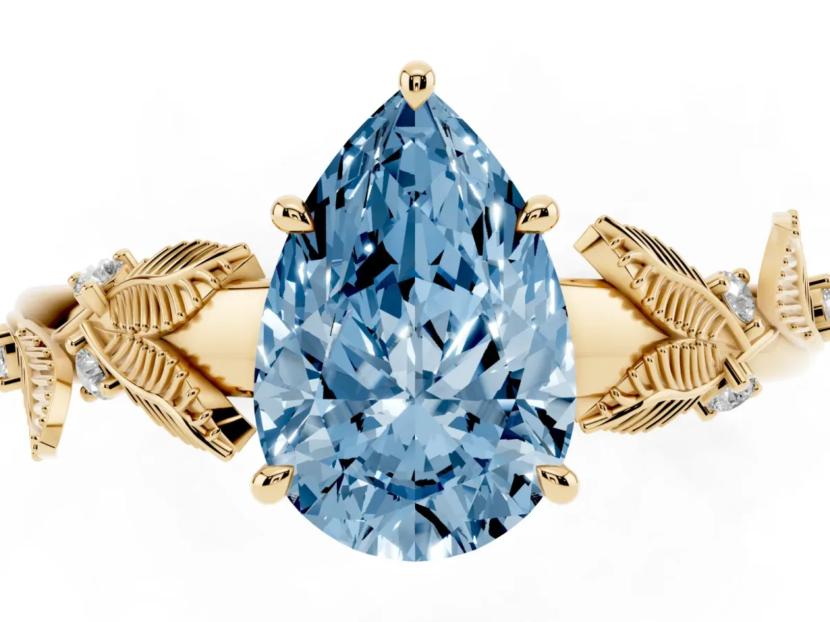 Fancy Blue Pear Cut Diamond Solitaire Ring with Leaf Motif Band and Four-Prong Setting Yellow gold