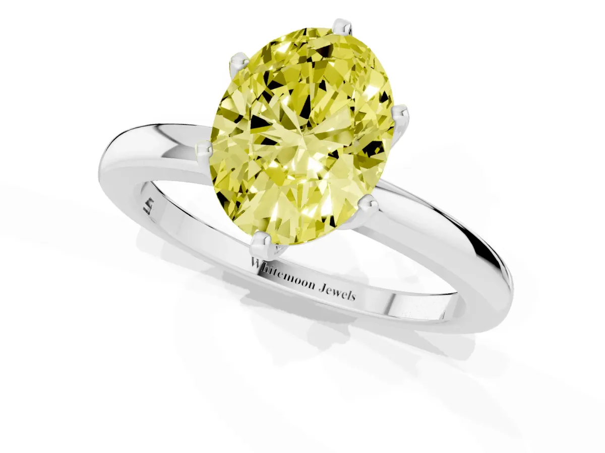 Fancy Yellow Oval Cut Solitaire Diamond Ring with Six-Prong Setting on a Classic Band Silver