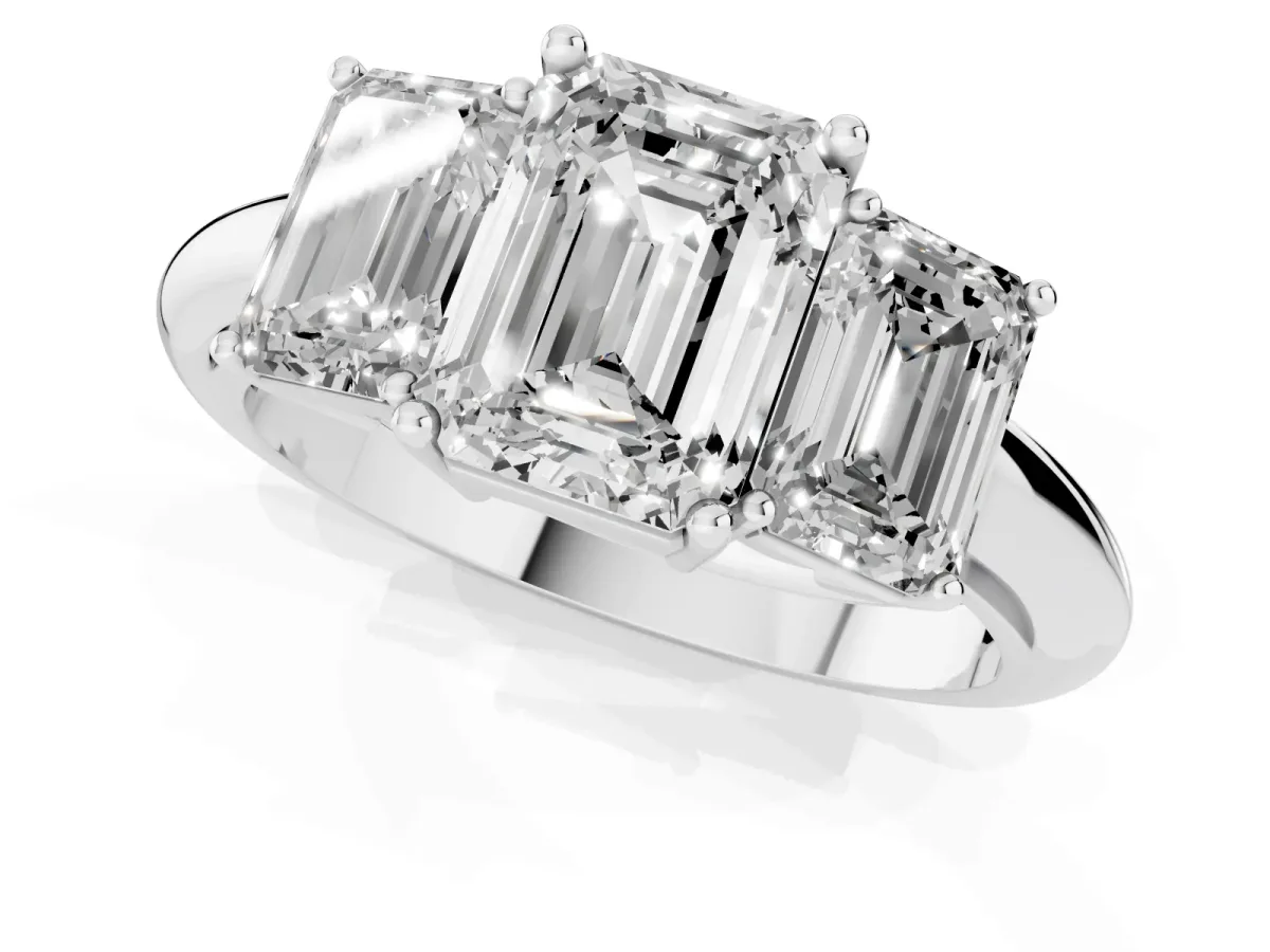 Three-Stone Emerald Cut Cut Diamond Engagement Ring with Prong Setting on a White Gold Band Platinum
