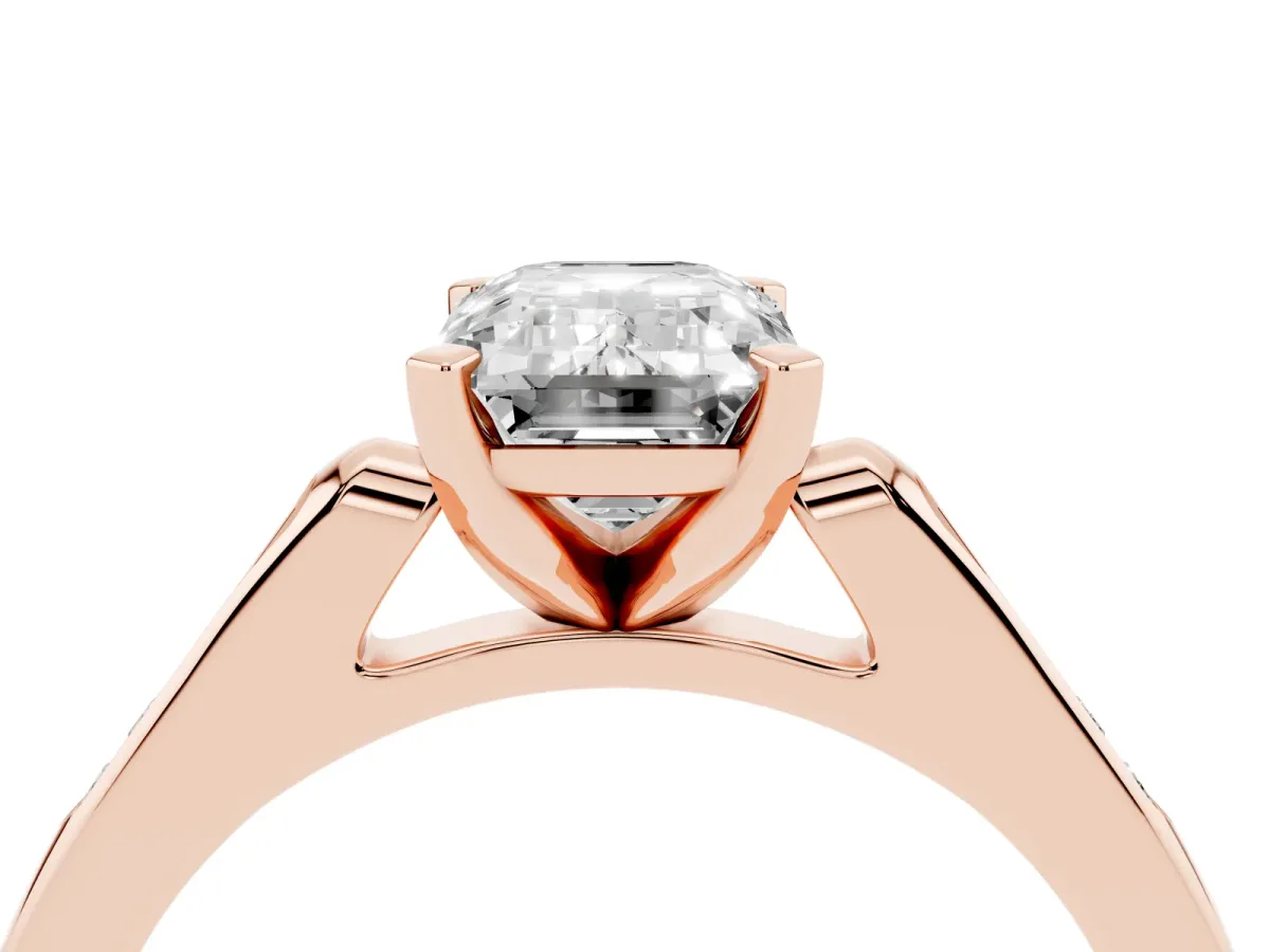 Emerald Cut Diamond Solitaire Ring with Channel Set Round Band and Prong Setting Rose gold