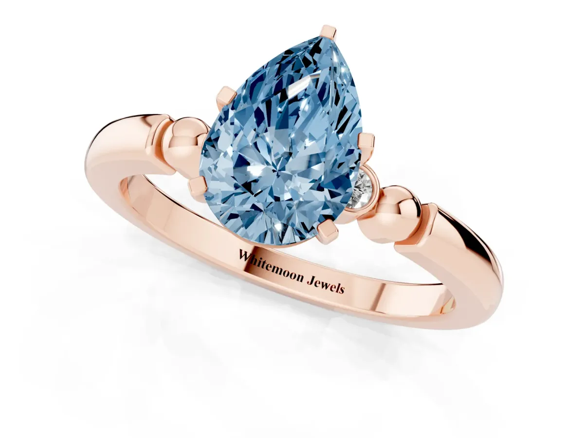 Fancy Blue Pear Cut Solitaire Beaded Band with Four-Prong Setting Rose gold