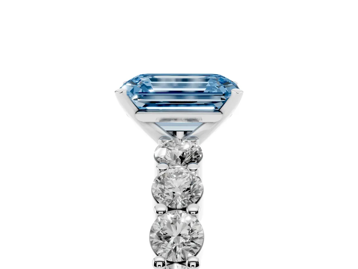 Fancy Blue Emerald Cut Diamond Solitaire Ring with Shared Prong Round Side Stones Platinum