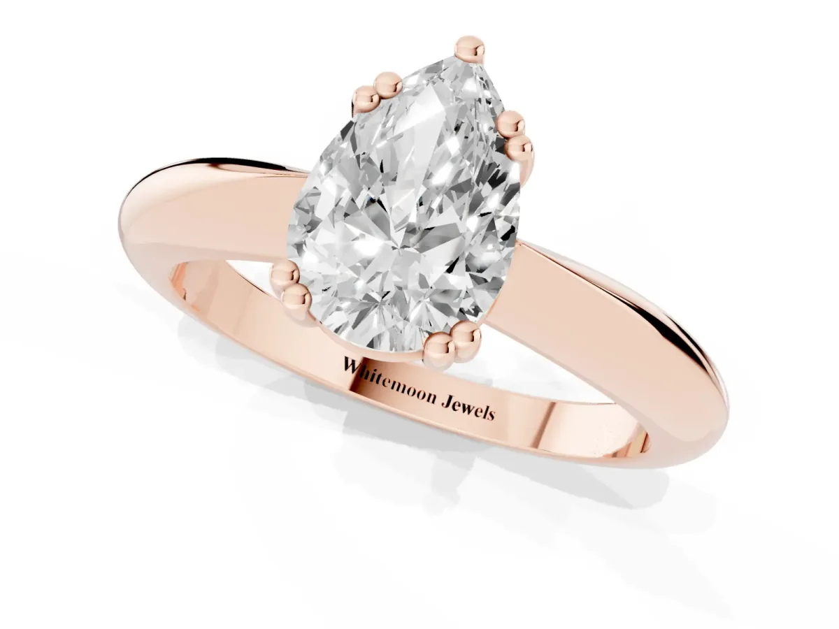 Pear Cut Cut Solitaire Engagement Ring with Tapered Band and Four-Prong Setting Rose gold