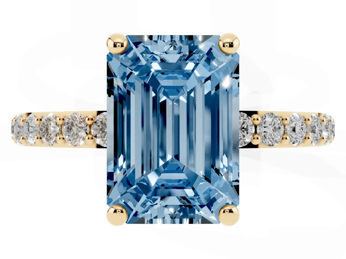 Fancy Blue Emerald Cut Diamond Solitaire Ring with Round Pavé Band and Prong Setting Yellow gold