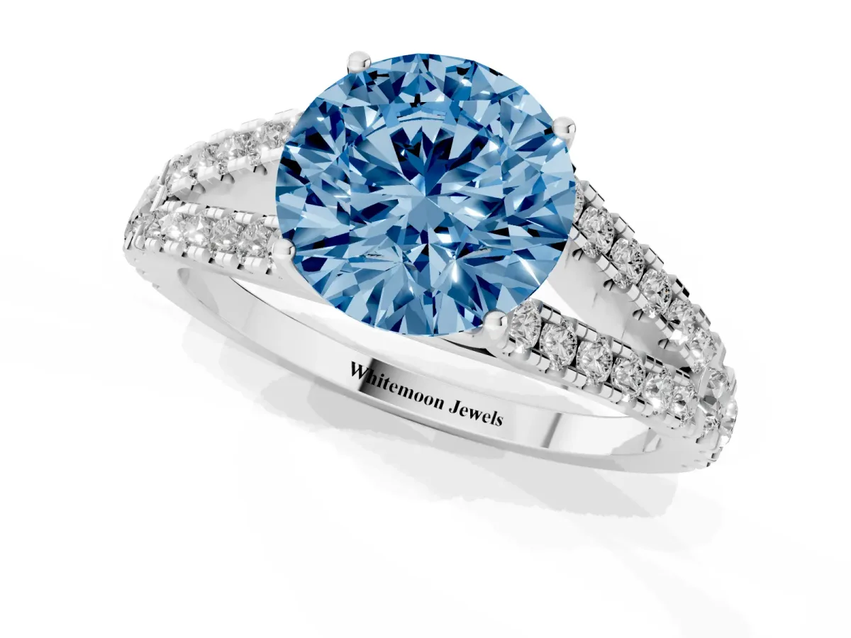 Fancy Blue Round Cut Diamond Split Shank Pavé Engagement Ring with Four-Prong Setting White gold