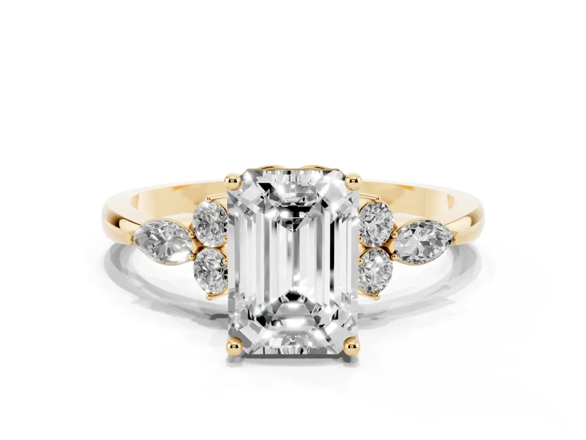 Emerald Cut Brilliant Diamond Solitaire Ring with Pear Side Stones and Four-Prong Setting Yellow gold