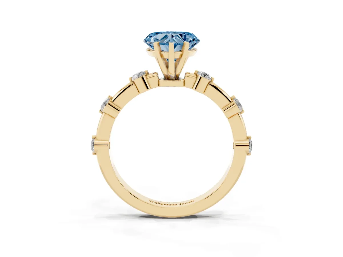 Fancy Blue Heart Cut Solitaire Diamond Ring with Bezel Set Side Stones and Prong Setting Yellow gold