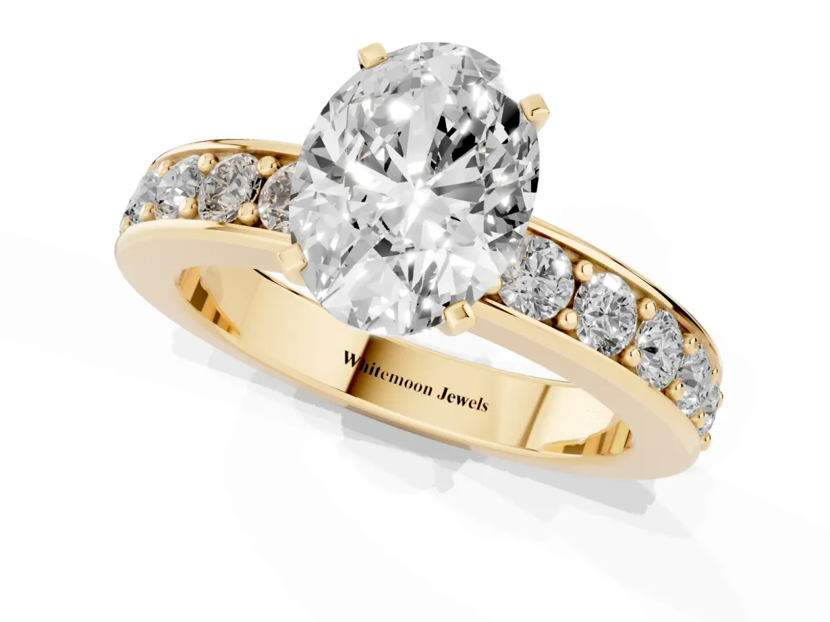 Oval Cut Diamond Engagement Ring with Channel Set Round Band and Prong Setting Yellow gold