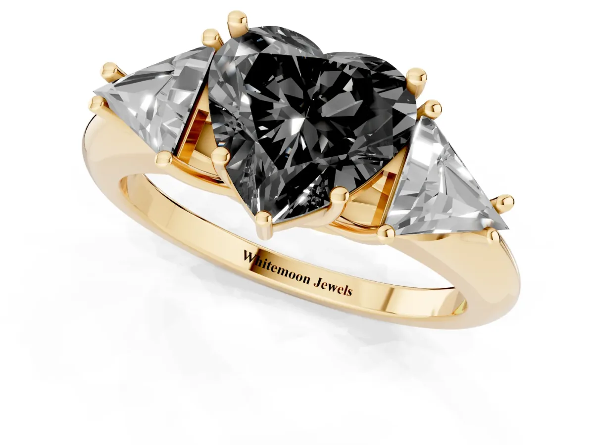Fancy Black Three-Stone Heart Cut Diamond Engagement Ring with Trillion Side Stones and Prong Setting Yellow gold