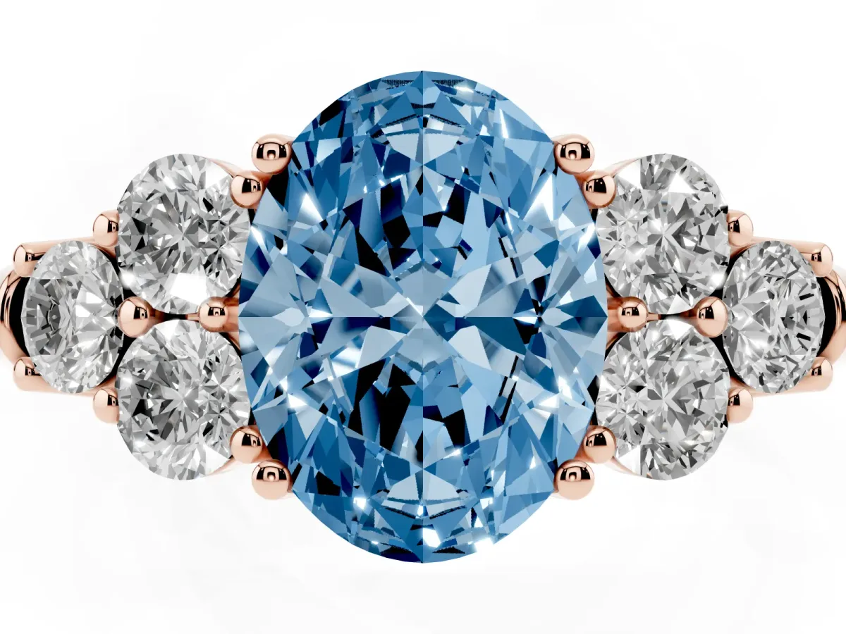 Fancy Blue Oval Cut Cut Diamond Cluster Ring with Round Accent Stones and Prong Setting on a Classic Band Rose gold