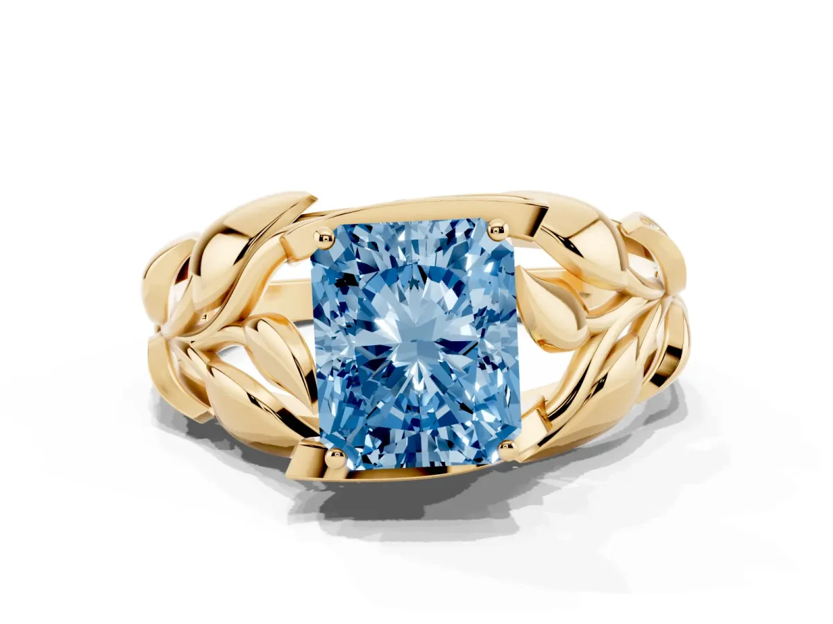 Fancy Blue Radiant Cut Diamond Leaf-Inspired Engagement Ring with Round Accents and Prong Setting Yellow gold