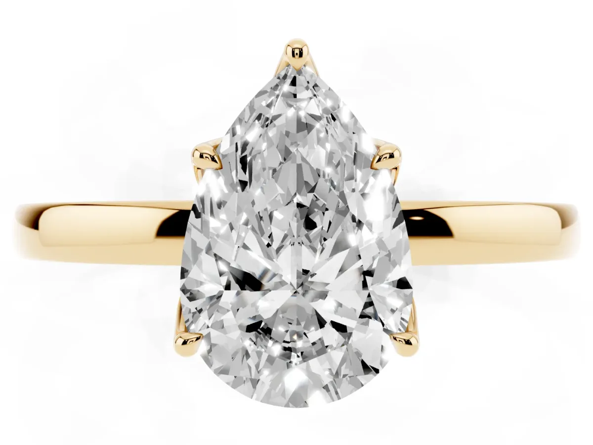 Pear Cut Diamond Solitaire Ring with Thin Band and Prong Setting Yellow gold