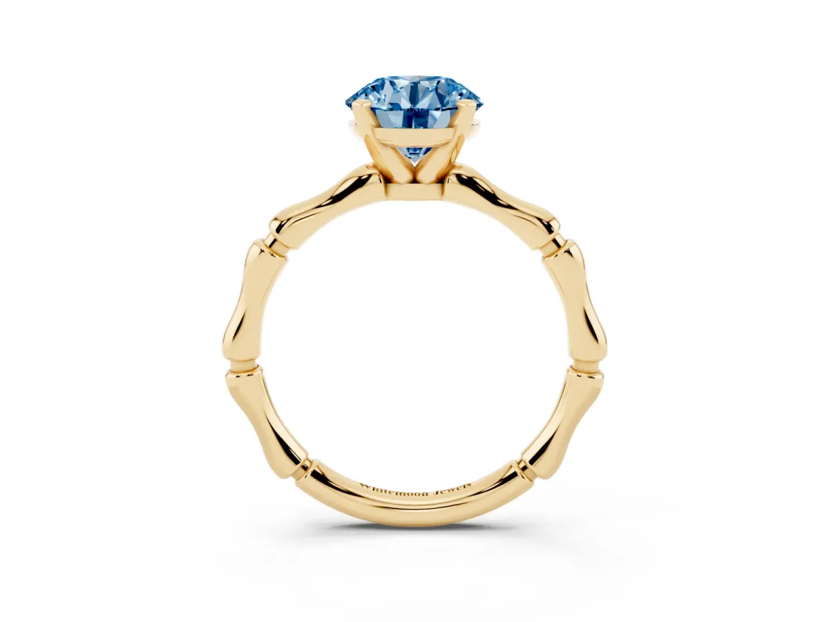 Fancy Blue Round Cut Solitaire Diamond Ring with Bamboo Band and Four-Prong Setting Yellow gold