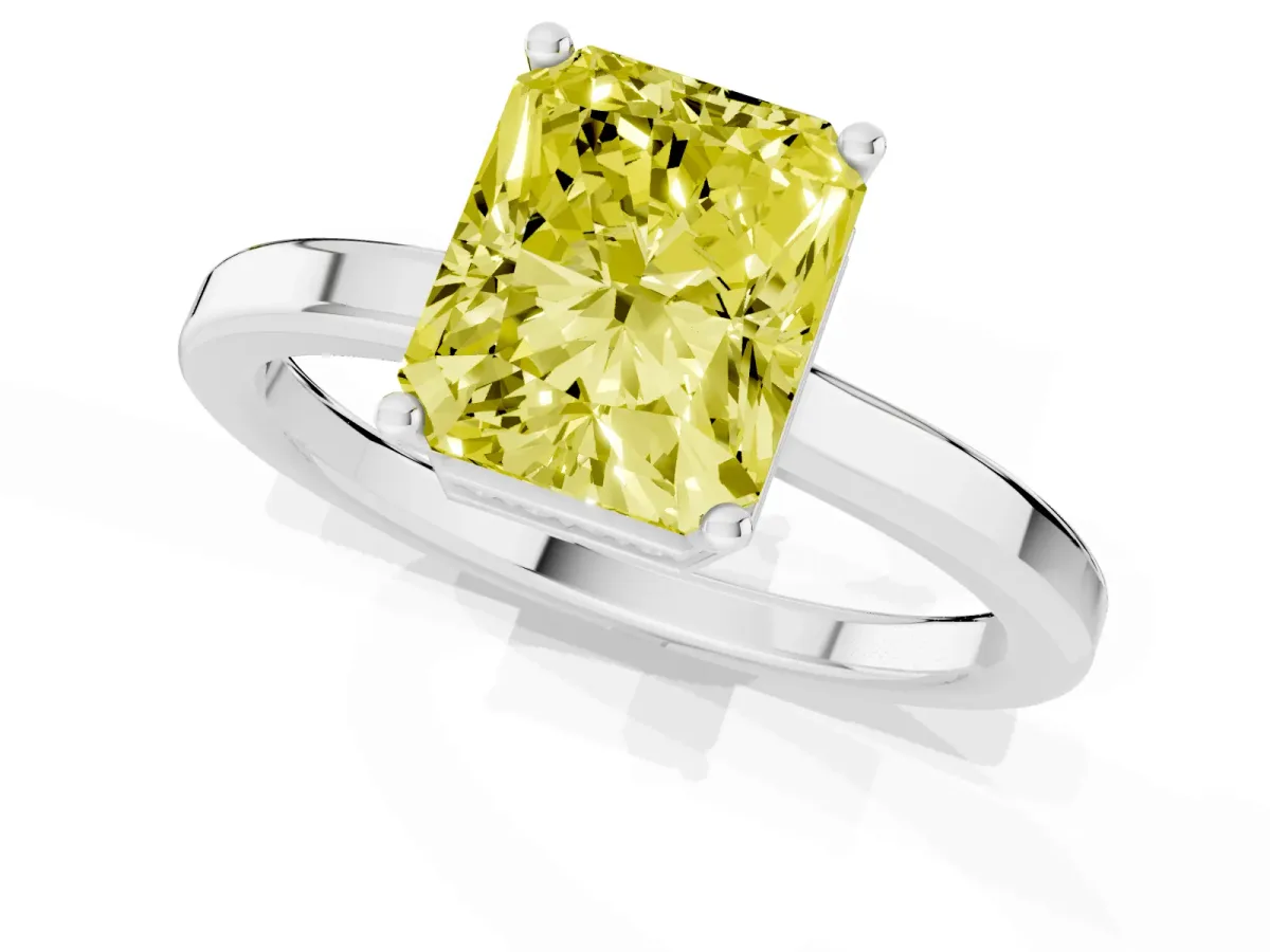 Fancy Yellow Radiant Cut Cut Solitaire Engagement Ring with Four-Prong Setting on a Classic Band Silver