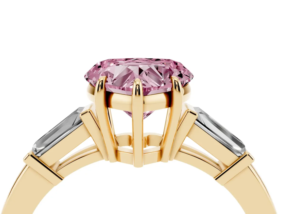 Fancy Pink Heart Cut Diamond Three-Stone Ring with Tapered Baguette Side Stones and Prong Setting Yellow gold