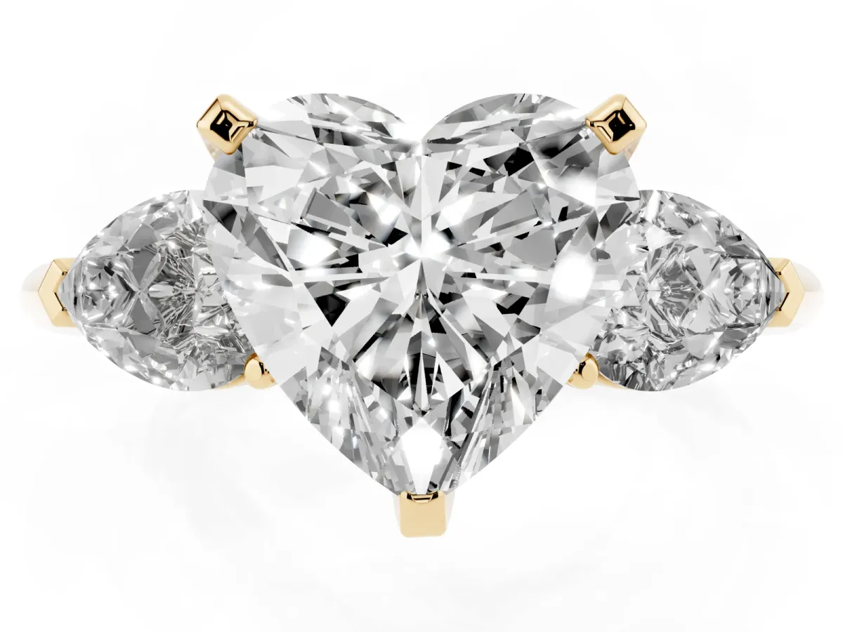 Three-Stone Heart Cut Diamond Ring with Pear Side Stones and Four-Prong Setting Yellow gold