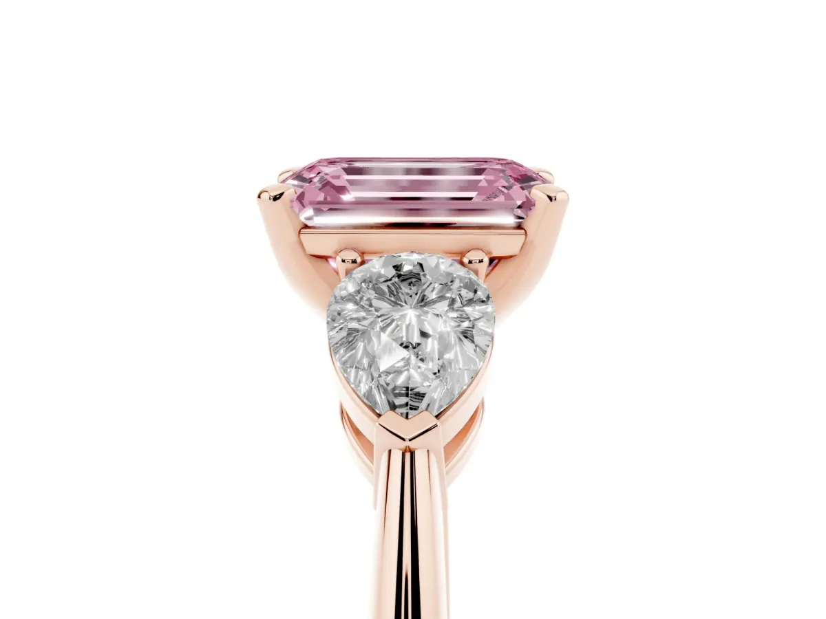 Fancy Pink Three-Stone Emerald Cut Diamond Ring with Pear Side Stones and Four-Prong Setting Rose gold