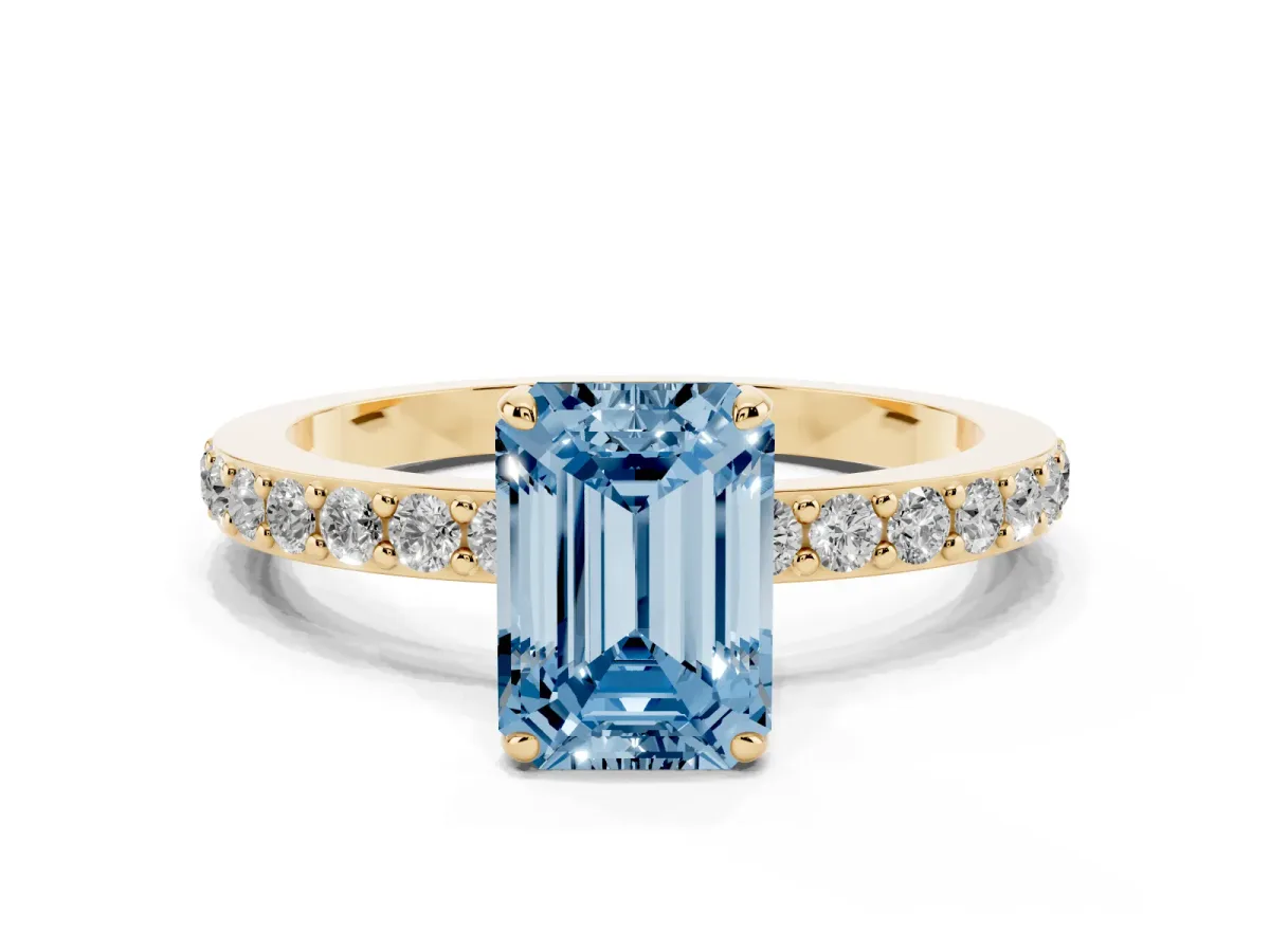 Fancy Blue Emerald Cut Diamond Pavé Engagement Ring with Round Accents and Prong Setting Yellow gold