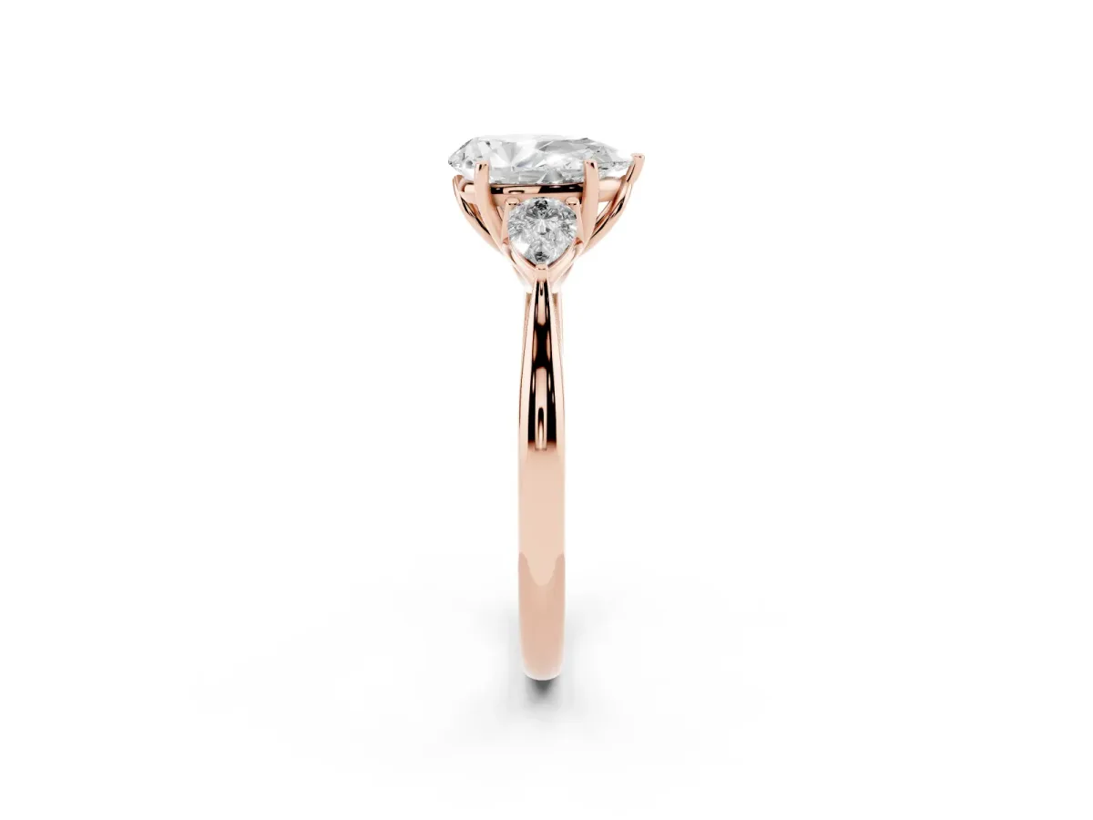 Three-Stone Pear Cut Diamond Ring with Pear Side Stones in Four-Prong Setting Rose gold