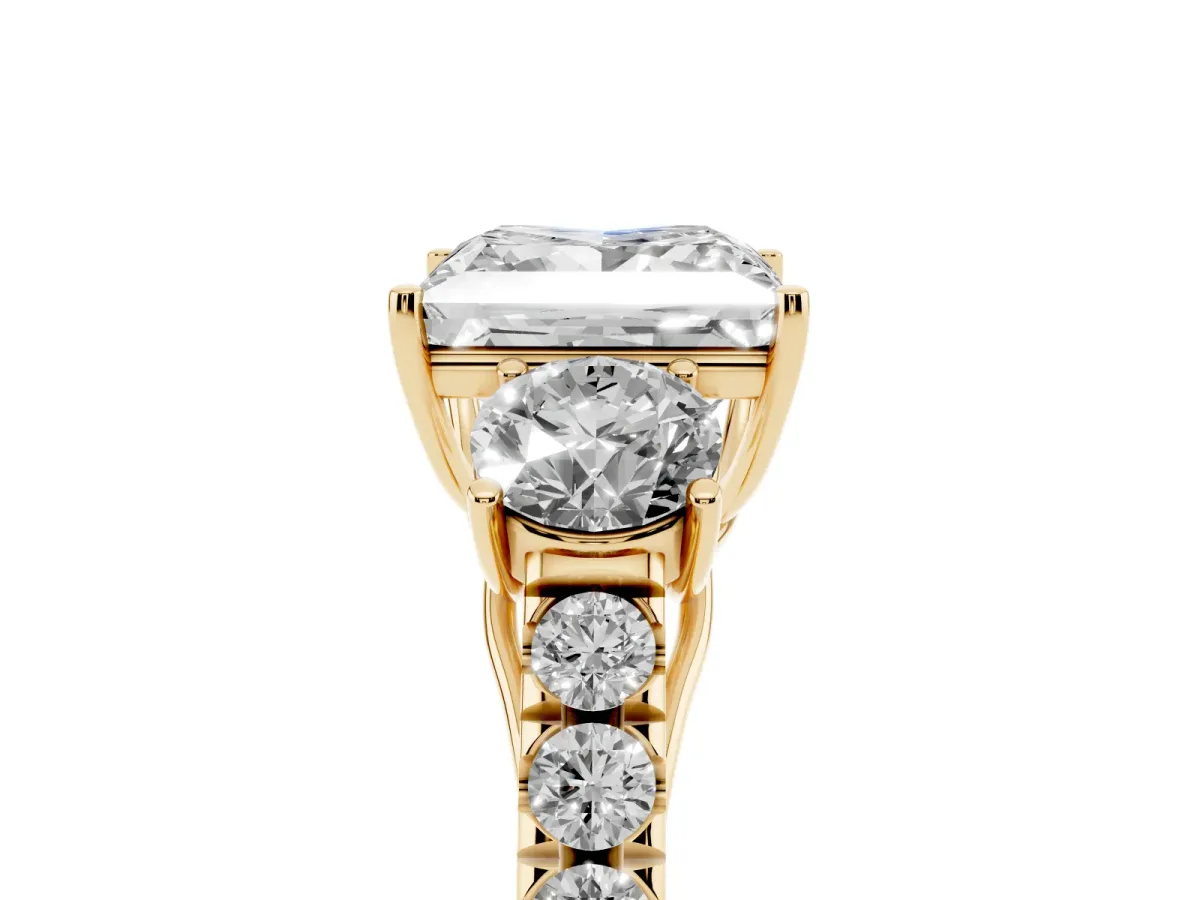 Princess Cut Cut Diamond Three-Stone Ring with Round Side Stones and Pavé Band Yellow gold