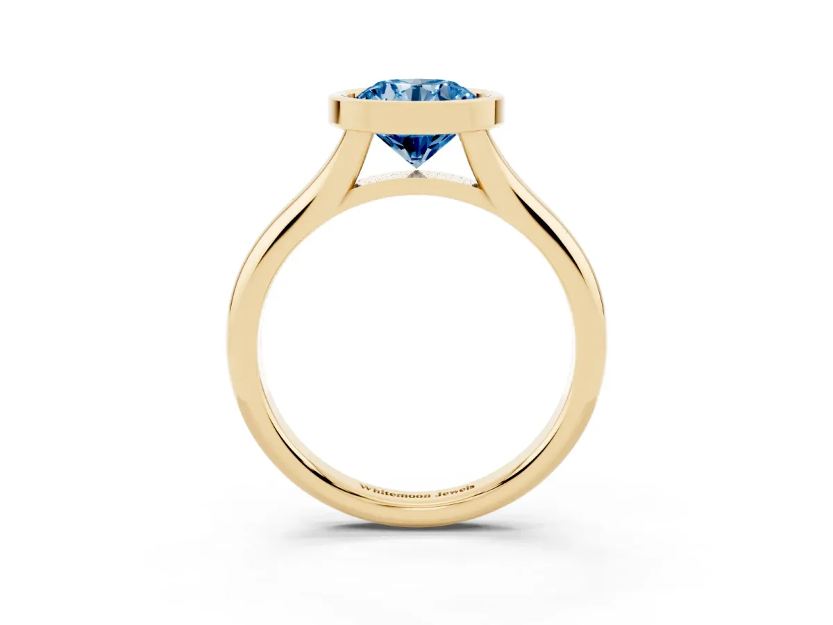 Fancy Blue Bezel Set Round Cut Solitaire Diamond Ring with Smooth Band Yellow gold