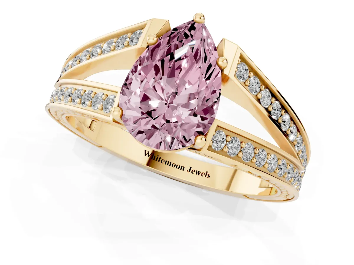 Fancy Pink Pear Cut Diamond Split Shank Ring with Pavé Band and Four-Prong Setting Yellow gold