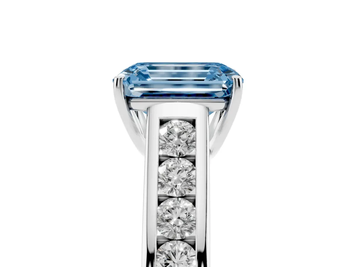 Fancy Blue Emerald Cut Brilliant Channel-Set Solitaire Ring with Four-Prong Setting Platinum