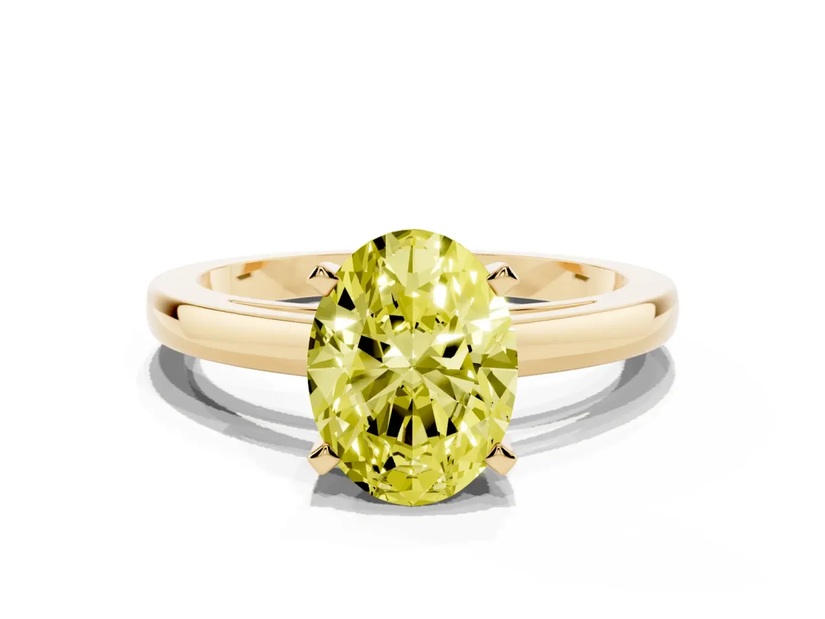 Fancy Yellow Oval Cut Solitaire Diamond Engagement Ring with Four-Prong Setting on a Classic Band Yellow gold
