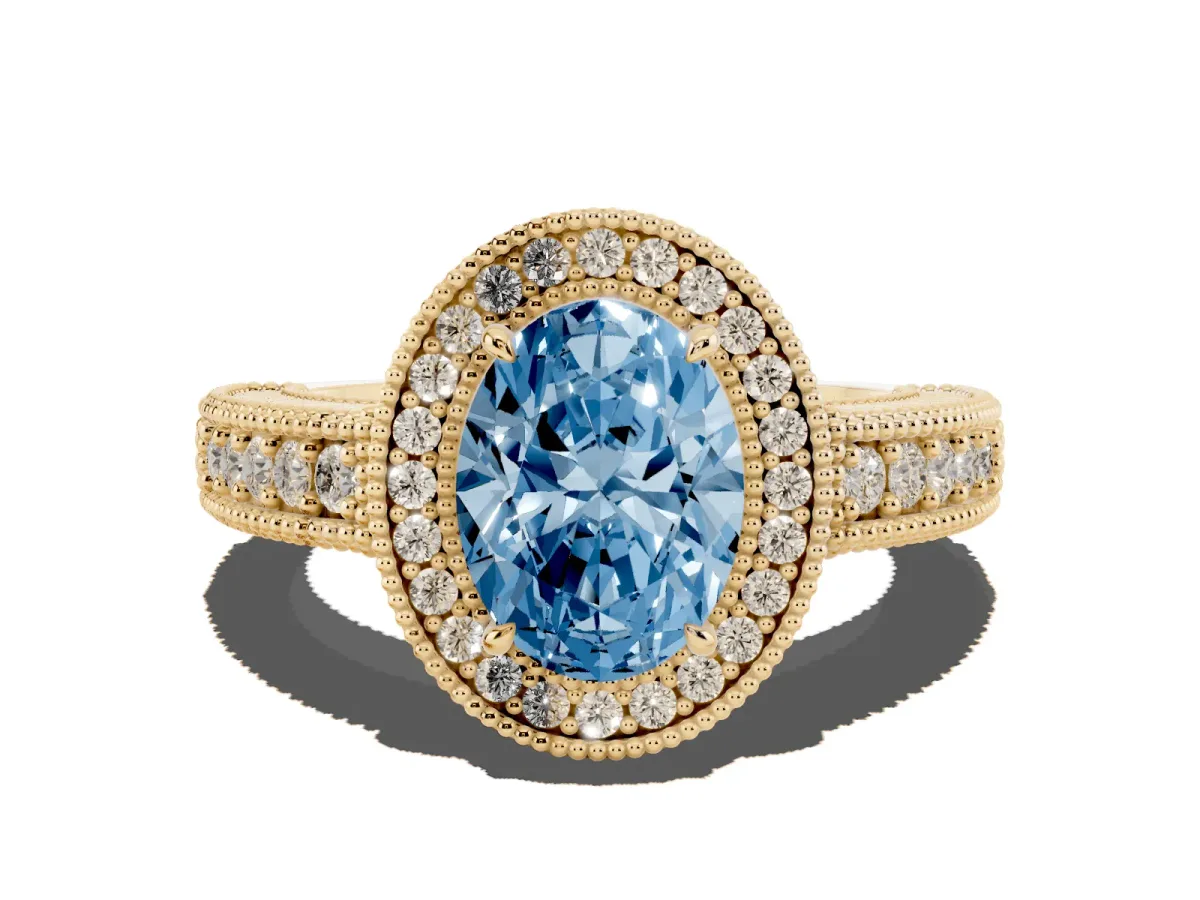 Fancy Blue Oval Cut Cut Halo Diamond Ring with Pavé Band and Four-Prong Setting Yellow gold